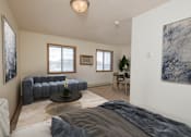 Thumbnail 2 of 7 - Fargo, ND Ashbury Apartments. a bedroom with a couch and a table