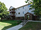 Thumbnail 6 of 7 - Fargo, ND Ashbury Apartments. Exterior of the front door