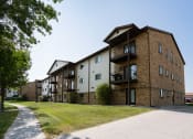 Thumbnail 13 of 13 - Exterior of a three level apartment.  Fargo, ND Auburn Apartments.