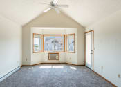 Thumbnail 5 of 13 - Fargo, ND Bayview Apartments. A living room with a ceiling fan
