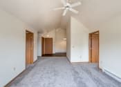 Thumbnail 6 of 13 - Fargo, ND Bayview Apartments. A living room with a ceiling fan