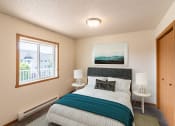 Thumbnail 4 of 13 - Fargo, ND Bayview Apartments. A bedroom with a bed and two windows