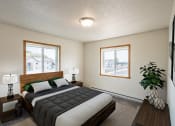 Thumbnail 3 of 13 - Fargo, ND Bayview Apartments. A bedroom with a bed and two windows