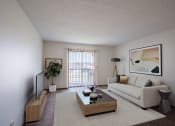 Thumbnail 1 of 15 - a living room with a white couch and a coffee table. Fargo, ND Bella Vista Apartments