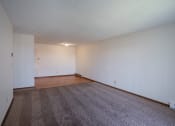 Thumbnail 6 of 15 - a living room with wood flooring and white walls. Fargo, ND Bella Vista Apartments