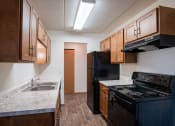 Thumbnail 13 of 15 - our apartments have a kitchen with a stove and a sink. Fargo, ND Bella Vista Apartments
