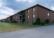 Thumbnail 15 of 15 - a large brick apartment building on the side of a road. Fargo, ND Bella Vista Apartments