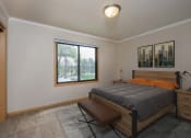 Thumbnail 5 of 16 - a bedroom with a large window and a large bed. Fargo, ND Birchwood 2 Apartments