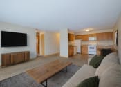 Thumbnail 1 of 16 - a living room with a couch and a coffee table. Fargo, ND Birchwood 2 Apartments