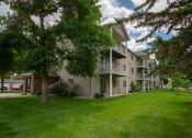 Thumbnail 25 of 26 - our apartments have a spacious yard with green grass and trees