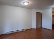 Thumbnail 6 of 26 - a dining room with wood flooring and white walls. Fargo, ND Briar Pointe Apartments