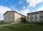 Thumbnail 11 of 13 - our apartments are on the corner of a green lawn and a blue sky. Fargo, ND Brookfield Apartments