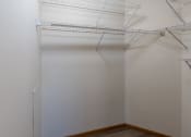 Thumbnail 12 of 17 - Fargo, ND Cambridge Apartments. A large closet with shelves.