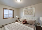 Thumbnail 4 of 16 - a bedroom with a bed and a window. Fargo, ND Crescent Park Apartments