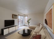 Thumbnail 2 of 16 - a living room with a couch and a coffee table and a tv. Fargo, ND Crescent Park Apartments