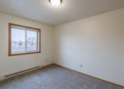 Thumbnail 9 of 16 - a bedroom with a window. Fargo, ND Crescent Park Apartments