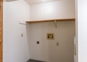 Thumbnail 15 of 16 - an empty room with white walls and a wooden beam on the ceiling. Fargo, ND Crescent Park Apartments