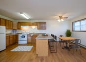 Thumbnail 3 of 12 - Fargo, ND Dynasty Apartments a kitchen and dining area