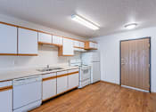 Thumbnail 26 of 28 - a kitchen with white appliances. Fargo, ND Eagle Run Apartments