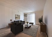 Thumbnail 1 of 28 - a living room with a couch and a coffee table. Fargo, ND Eagle Run Apartments