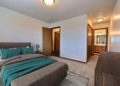 Thumbnail 7 of 23 - Fargo, ND Flagstone Apartments. a bedroom with a bed and a dresser