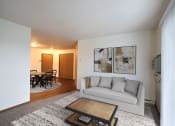 Thumbnail 4 of 23 - Fargo, ND Flagstone Apartments. a living room with a couch and a coffee table