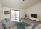 Thumbnail 5 of 18 - Fargo, ND Flickertail Apartments a living room with couches and a coffee table