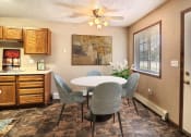 Thumbnail 4 of 19 - Fargo, ND Foxboro Townhomes. a dining room with a table and chairs