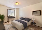 Thumbnail 6 of 19 - Fargo, ND Foxboro Townhomes. a bedroom with a bed and a window