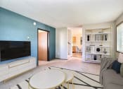 Thumbnail 3 of 19 - Fargo, ND Foxboro Townhomes. a living room with a couch table and television