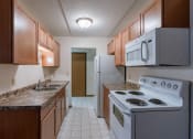 Thumbnail 21 of 25 - a kitchen with white tile floors and white appliances at France, Fargo, ND 58103