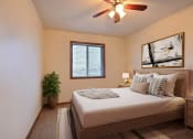 Thumbnail 5 of 25 - a bedroom with a large bed and a ceiling fan at France, Fargo, ND 58103