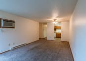 Thumbnail 5 of 19 - an empty living room with carpet and a ceiling fan. Fargo, ND Galleria 3 Apartments