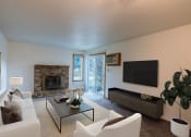 Thumbnail 1 of 19 - a living room with a couch and a tv and a fireplace. Fargo, ND Galleria 3 Apartments
