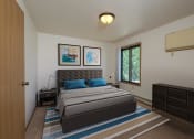 Thumbnail 4 of 14 - a bedroom with a bed and two dressers. Fargo, ND Hazelwood Townhomes