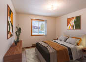 Thumbnail 4 of 13 - a bedroom with a bed and a window. Fargo, ND Huntington Apartments