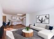 Thumbnail 2 of 49 - a living room with a white couch and a table. Fargo, ND Lake Crest Apartments
