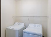 Thumbnail 32 of 49 - Fargo, ND Lake Crest Apartments. a room with two washers and a dryer in it