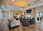 Thumbnail 45 of 49 - Fargo, ND Lake Crest Apartments.  living room filled with furniture and a flat screen tv