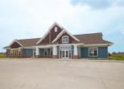 Thumbnail 42 of 49 - Fargo, ND Lake Crest Apartments. A large house with a parking lot in front of it
