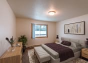 Thumbnail 3 of 30 - a bedroom with a bed and a window. Fargo, ND Long Island Apartments