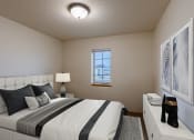 Thumbnail 5 of 13 - a bedroom with a large bed and a window. Moorhead, MN Townhomes at Mallard Creek