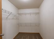 Thumbnail 9 of 13 - a closet with three shelves. Moorhead, MN Mallard Creek Apartments