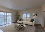 Thumbnail 2 of 13 - a living room with a couch and a coffee table. Moorhead, MN Townhomes at Mallard Creek