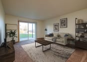 Thumbnail 4 of 17 - an open living room with a couch and a coffee table. Fargo, ND Maybrook Apartments