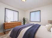 Thumbnail 5 of 15 - Fargo, ND Morningside Apartments.  A bedroom with a large bed and two windows brighten the room