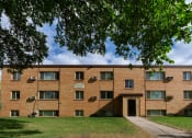 Thumbnail 15 of 15 - a brick building with a sidewalk and a tree. Fargo, ND Morningside Apartments