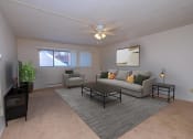 Thumbnail 3 of 16 - a living room with a couch and a coffee table. Fargo, ND North Manor Apartments