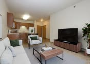 Thumbnail 2 of 25 - a living room with a couch and a coffee table. Fargo, ND North Sky Apartments