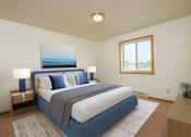 Thumbnail 5 of 11 - Bedroom with a blue and white bed and a window, Oak Court Apartments , ND  58103